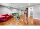 Open basement layout with furniture, wood floors and a movie screen on the wall at 1303 Bass Dr, Woodstock, GA 30189