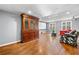 Finished basement with wooden style floors, entertainment cabinet, and comfortable seating at 1303 Bass Dr, Woodstock, GA 30189
