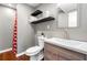 Modern bathroom with stylish vanity, shelves, and decor at 1303 Bass Dr, Woodstock, GA 30189