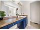 Bathroom featuring a large vanity with blue cabinets and ample counter space at 1303 Bass Dr, Woodstock, GA 30189
