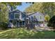 Beautiful two-story home with a manicured lawn, stone walkway, and inviting front entrance at 1303 Bass Dr, Woodstock, GA 30189
