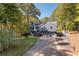 Charming two-story home with a well-maintained lawn, three-car garage, and inviting front entrance at 1303 Bass Dr, Woodstock, GA 30189