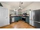 Spacious kitchen featuring modern appliances, stainless steel accents, and lots of natural light at 1303 Bass Dr, Woodstock, GA 30189