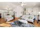Bright living room with large windows, hardwood floors and French doors leading to another living space at 1303 Bass Dr, Woodstock, GA 30189