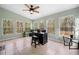 Bright sunroom with multiple windows providing natural light and a view of the outdoors at 1303 Bass Dr, Woodstock, GA 30189