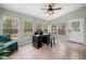 Spacious sunroom with tile flooring, many windows, and an exterior door at 1303 Bass Dr, Woodstock, GA 30189