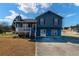 Inviting two-story home featuring a cozy front porch, ample parking, and a well-maintained lawn at 170 Cobblestone Ct, Douglasville, GA 30134