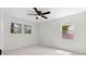 Bright bedroom with white walls, carpet, ceiling fan and views to the exterior at 2405 Clifton Springs Rd, Decatur, GA 30034