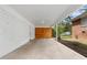 Covered carport featuring painted brick wall and wood paneling at 2405 Clifton Springs Rd, Decatur, GA 30034