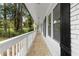 Inviting white porch with classic black shutters, offering a serene outdoor space at 2405 Clifton Springs Rd, Decatur, GA 30034