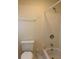 Bathroom with a bathtub, towel bar, and toilet at 3259 S Pointe Ct, Atlanta, GA 30340