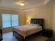 Bright bedroom featuring a queen size bed and soft carpet that offers a comfortable retreat at 3259 S Pointe Ct, Atlanta, GA 30340