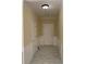 Well-lit foyer features tile flooring, white wainscoting, and a white front door at 3259 S Pointe Ct, Atlanta, GA 30340