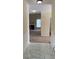 Inviting entryway with tile floors that leads to a carpeted living room featuring a fireplace at 3259 S Pointe Ct, Atlanta, GA 30340