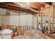 View of unfinished basement space for storage with ladder, boxes and construction elements at 2138 Bramlett Nw Pl, Marietta, GA 30064