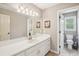 Bright bathroom featuring a large mirror, ample vanity space, and a separate toilet area at 2138 Bramlett Nw Pl, Marietta, GA 30064