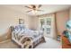 Inviting bedroom with a patterned quilt, a window view, and a warm, comfortable atmosphere at 2138 Bramlett Nw Pl, Marietta, GA 30064
