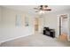 Bedroom featuring a ceiling fan, a decorative accent wall, and ample natural light at 2138 Bramlett Nw Pl, Marietta, GA 30064