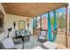 Cozy covered outdoor deck with seating, rug, curtains and decorative elements at 2138 Bramlett Nw Pl, Marietta, GA 30064