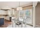 Bright breakfast nook featuring windows, pillar and chandelier at 2138 Bramlett Nw Pl, Marietta, GA 30064
