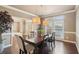 Elegant dining room with a dark wood table, hardwood floors, and neutral wall colors at 2138 Bramlett Nw Pl, Marietta, GA 30064