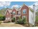 Charming two-story brick home with a two-car garage and a well-manicured lawn at 2138 Bramlett Nw Pl, Marietta, GA 30064