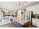 Open-concept kitchen featuring an island with a granite countertop and stainless steel appliances at 2138 Bramlett Nw Pl, Marietta, GA 30064