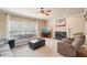 Cozy living room with a fireplace, plush seating, and lots of natural light at 2138 Bramlett Nw Pl, Marietta, GA 30064