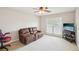 Cozy living room with plush recliner seating, a ceiling fan, and streaming natural light at 2138 Bramlett Nw Pl, Marietta, GA 30064