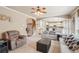 Bright and spacious living room with fireplace and archway to the kitchen and stairs at 2138 Bramlett Nw Pl, Marietta, GA 30064