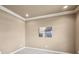 Neutral room with carpeted floors, baseboard trim and crown molding, offering a clean and customizable space at 2138 Bramlett Nw Pl, Marietta, GA 30064