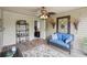Relaxing screened porch with wood floors and ceiling, stylish ceiling fan, and comfortable seating at 2138 Bramlett Nw Pl, Marietta, GA 30064