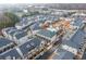 Beautiful aerial view of the neighborhood featuring modern townhomes, landscaping, and a community pool on an overcast day at 3933 Danube Ln # 224, Atlanta, GA 30339