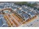 Beautiful aerial view of the neighborhood featuring modern townhomes, landscaping, and a community pool on an overcast day at 3933 Danube Ln # 224, Atlanta, GA 30339