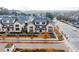 View of townhome with brick exterior, manicured lawn, and well-maintained landscaping on a cloudy day at 3933 Danube Ln # 224, Atlanta, GA 30339