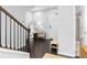 Inviting foyer featuring hardwood floors, a bench, a mirror, and convenient access to a full bathroom at 3933 Danube Ln # 224, Atlanta, GA 30339