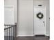 Hallway with white doors and winter wreaths on two of the doors at 3933 Danube Ln # 224, Atlanta, GA 30339