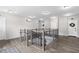 Hallway with wooden floors and banisters that overlooks stairs leading down to the lower level at 3933 Danube Ln # 224, Atlanta, GA 30339