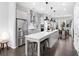 Spacious kitchen with an island, stainless steel appliances, and dark hardwood floors at 3933 Danube Ln # 224, Atlanta, GA 30339