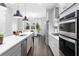 Modern kitchen with a large island, stainless steel appliances, and an open layout to the living area at 3933 Danube Ln # 224, Atlanta, GA 30339