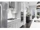 Bright kitchen with stainless steel appliances, white countertops, and grey cabinets at 3933 Danube Ln # 224, Atlanta, GA 30339