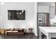 Open-concept living space featuring modern furnishings, stainless steel kitchen appliances, and decor at 3933 Danube Ln # 224, Atlanta, GA 30339