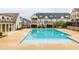 Beautiful community pool with clear water, inviting cabanas, and attractive townhome surroundings for leisure at 3933 Danube Ln # 224, Atlanta, GA 30339