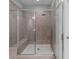 Modern bathroom featuring a large tiled shower with glass enclosure and convenient bench seating at 3933 Danube Ln # 224, Atlanta, GA 30339