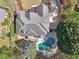 Aerial view of the property showing roof, driveway, backyard pool, and surrounding trees at 4215 Homestead Ridge Dr, Cumming, GA 30041