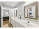 Bright bathroom featuring double sinks, tile floors, and large mirrors at 4215 Homestead Ridge Dr, Cumming, GA 30041