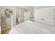 Bedroom featuring ensuite bathroom, closet and white bedding at 4215 Homestead Ridge Dr, Cumming, GA 30041