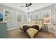 Bedroom with neutral decor, multiple windows, and decorative side tables at 4215 Homestead Ridge Dr, Cumming, GA 30041