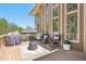 Outdoor deck area with chairs, grill, and view of the backyard, perfect for entertaining at 4215 Homestead Ridge Dr, Cumming, GA 30041