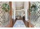 Grand foyer showcasing a staircase, hardwood floors, and elegant decor at 4215 Homestead Ridge Dr, Cumming, GA 30041